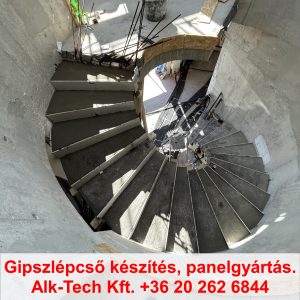 Szerkezetkész íves gipszlépcső csigalépcső formában, építés végi állapot